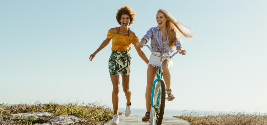 Woman laughing at the beach